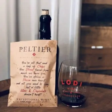 A bag of potato chips with a poem on it paired with a glass of USB dessert