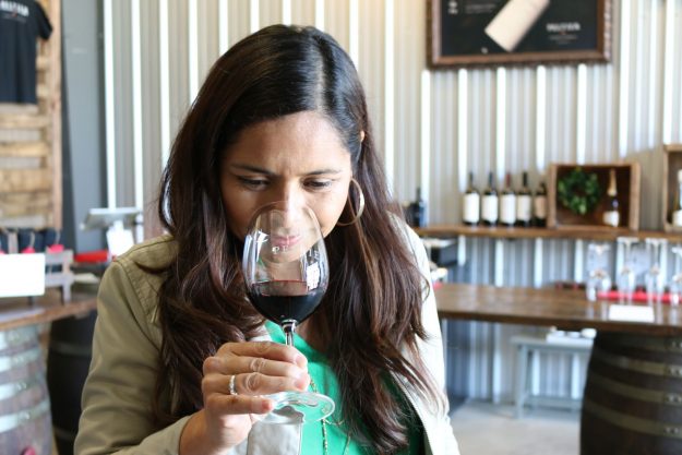 Woman smelling wine in a wine glass