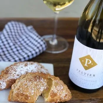 cheese empanadas and a bottle of chardonnay