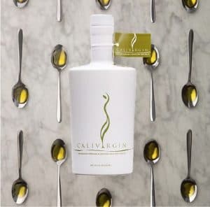 Calivirgin olive oil bottle with spoons of oil