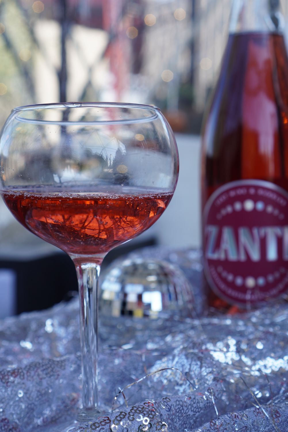 ZANTE House of Chill: a glass of ZANTE next to the bottle on a table ZANTE House of Chill: a glass of ZANTE next to the bottle on a table